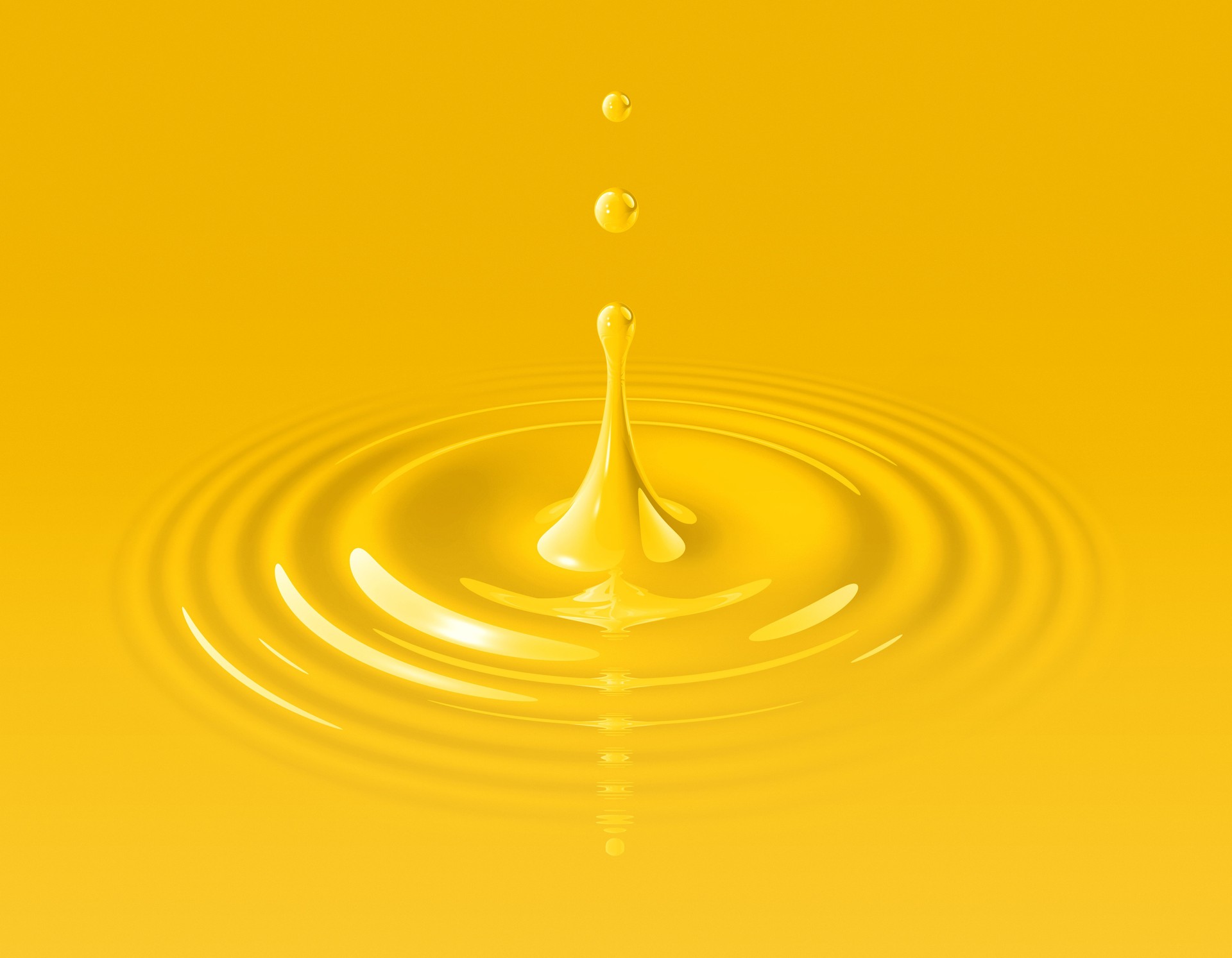 Yellow paint drop and ripple